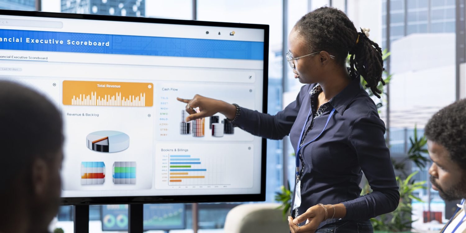 Advisory board members and team leaders gathering to review project outcomes, discuss resource allocation to ensure objectives achievement. Diverse business associates in a meeting.